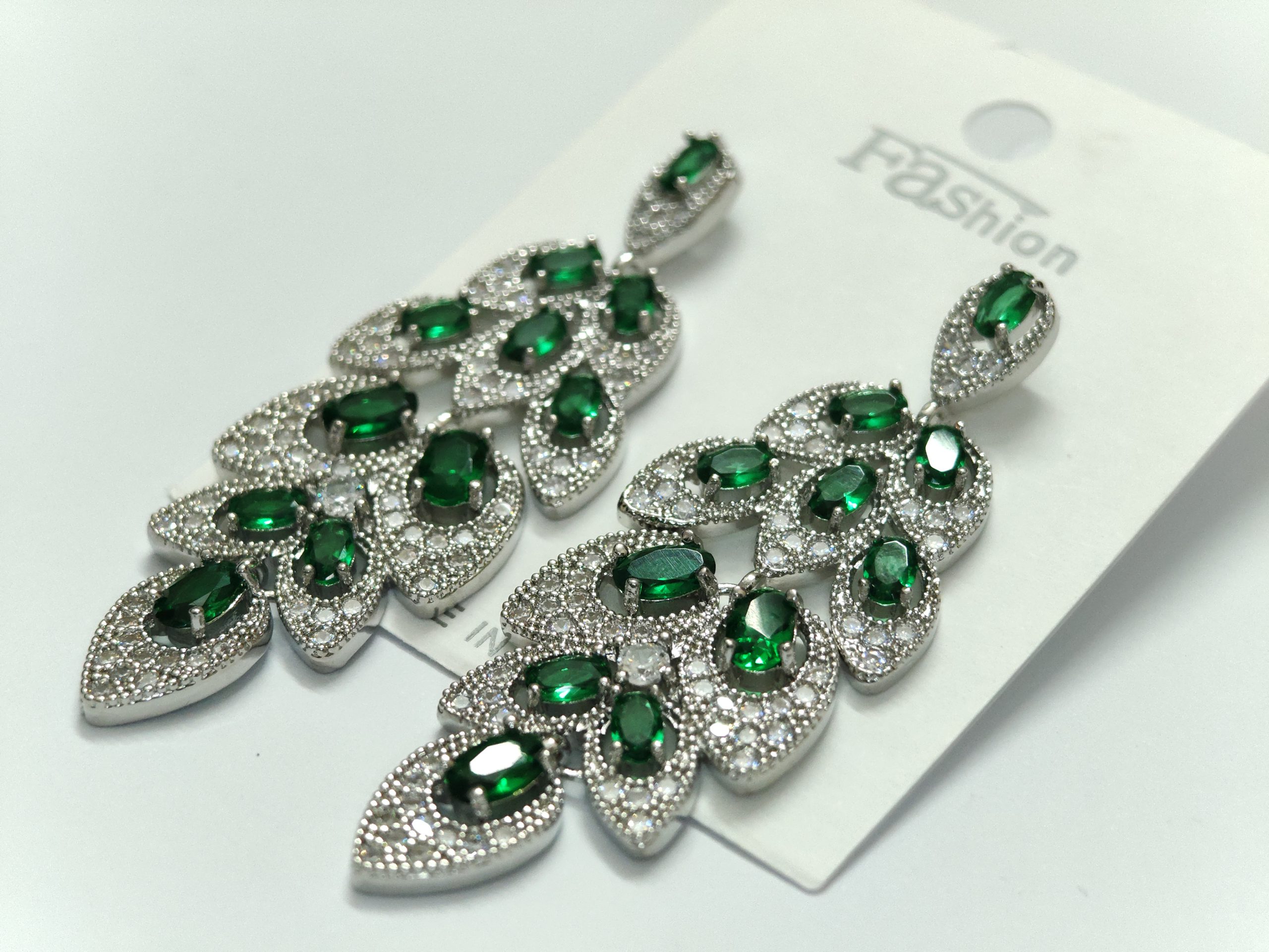 Emerald-green crystal chandelier drop earrings in a silver-tone pavé setting — Sira Elegance