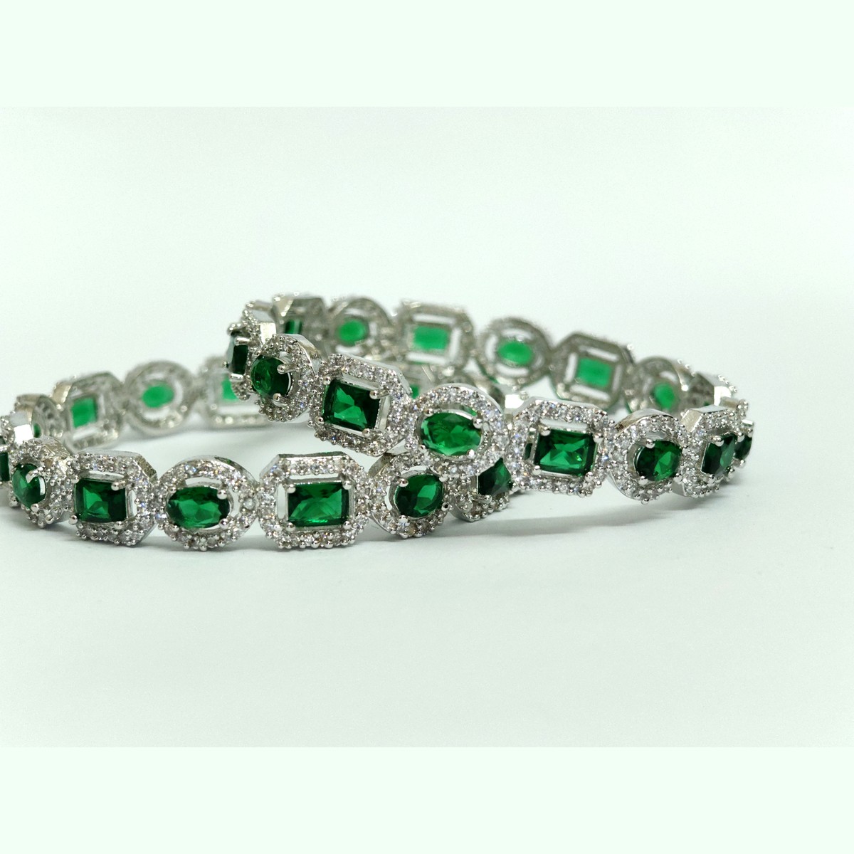 Pair of two-row emerald-green statement bangles in silver-tone — Sira Elegance