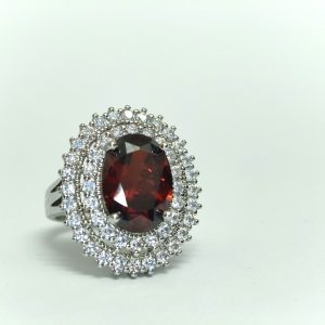 Garnet-red oval double-halo statement ring in silver-tone — Sira Elegance