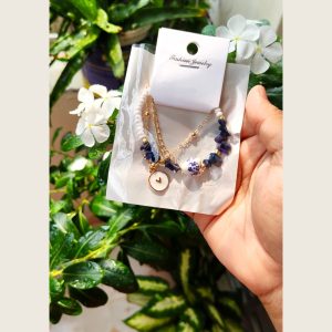Layered gold-tone bracelet with pearl beads and lapis-blue stone chips — Sira Elegance