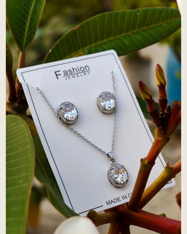 Round crystal halo pendant necklace with matching stud earrings, silver-tone set — Sira Elegance